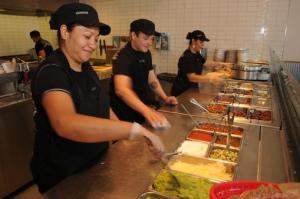 Chipotle employees working hard during the Boorito Event Photo By Bizjournals.com